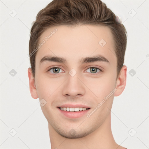 Joyful white young-adult male with short  brown hair and grey eyes