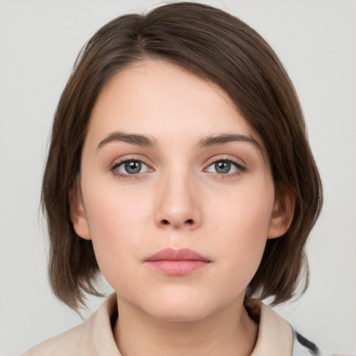 Neutral white young-adult female with medium  brown hair and grey eyes