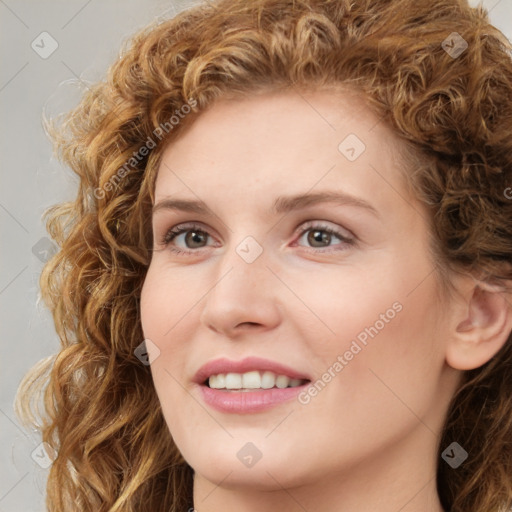 Joyful white young-adult female with long  brown hair and green eyes