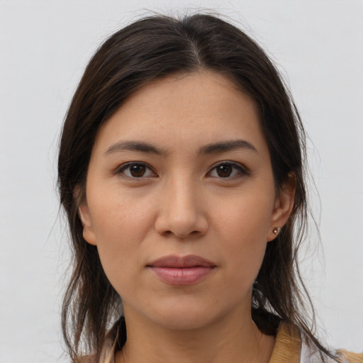 Joyful white young-adult female with medium  brown hair and brown eyes