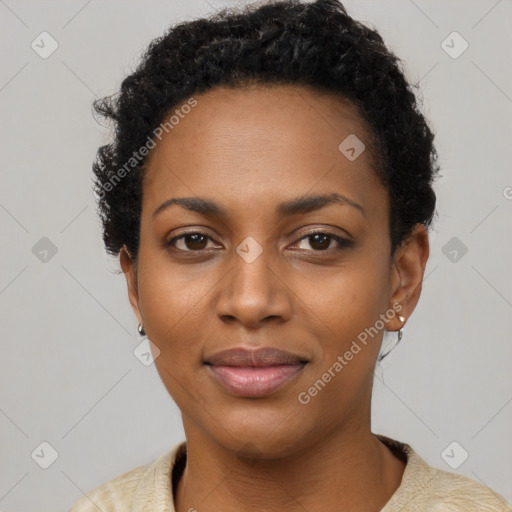 Joyful black young-adult female with short  black hair and brown eyes