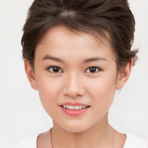 Joyful white child female with short  brown hair and brown eyes