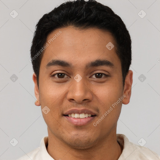 Joyful latino young-adult male with short  black hair and brown eyes