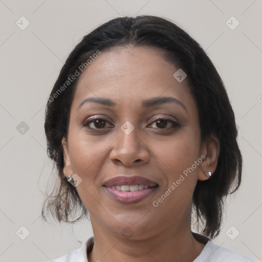 Joyful asian adult female with medium  brown hair and brown eyes