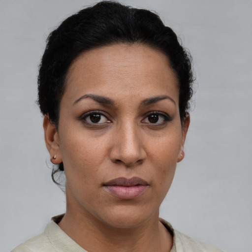Neutral latino young-adult female with short  brown hair and brown eyes