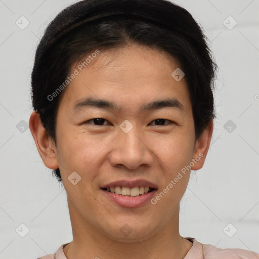 Joyful asian young-adult male with short  brown hair and brown eyes