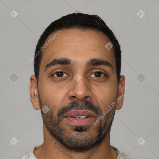 Neutral latino young-adult male with short  brown hair and brown eyes