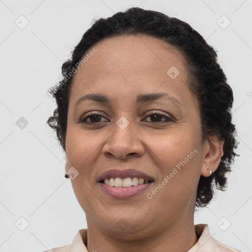 Joyful latino young-adult female with short  brown hair and brown eyes