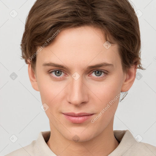 Joyful white young-adult female with short  brown hair and grey eyes