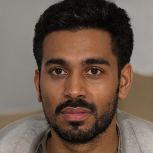Neutral black young-adult male with short  black hair and brown eyes