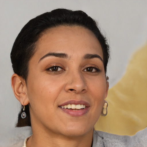 Joyful latino young-adult female with short  brown hair and brown eyes