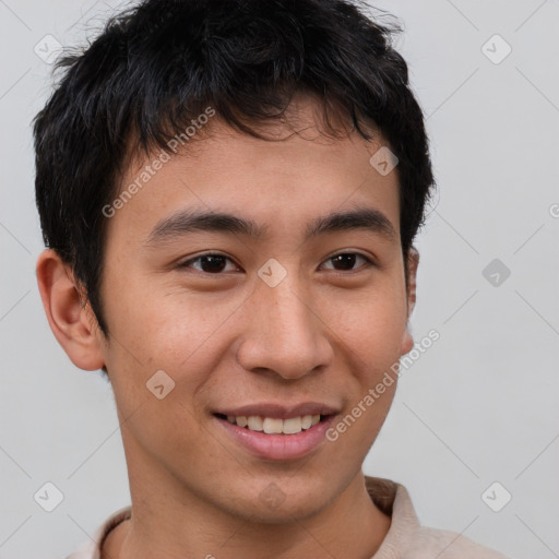 Joyful asian young-adult male with short  brown hair and brown eyes