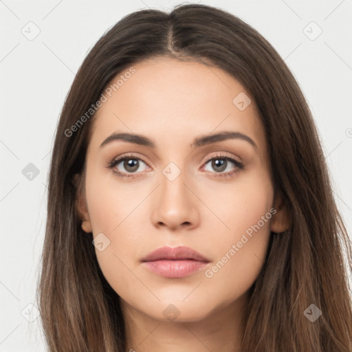 Neutral white young-adult female with long  brown hair and brown eyes