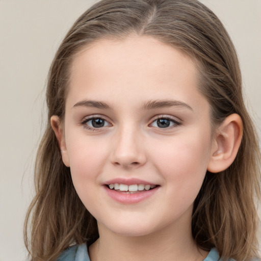 Joyful white child female with medium  brown hair and grey eyes