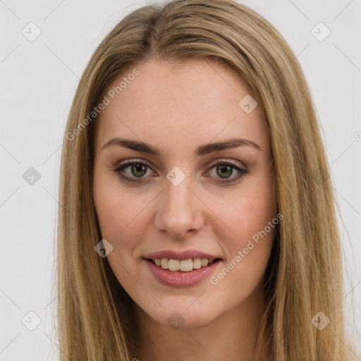 Joyful white young-adult female with long  brown hair and green eyes