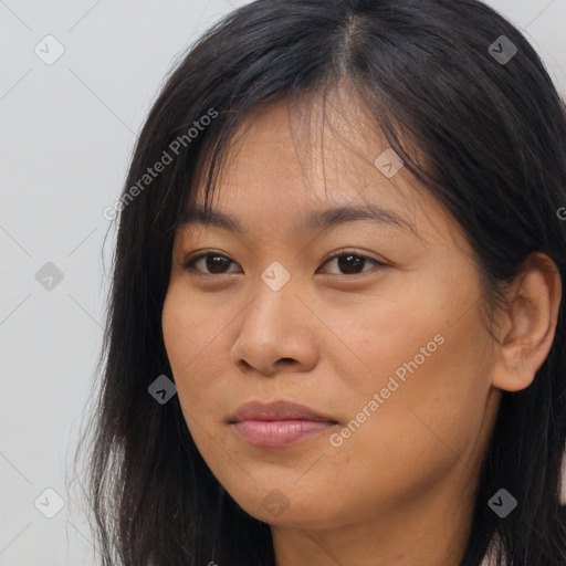 Joyful asian young-adult female with long  brown hair and brown eyes