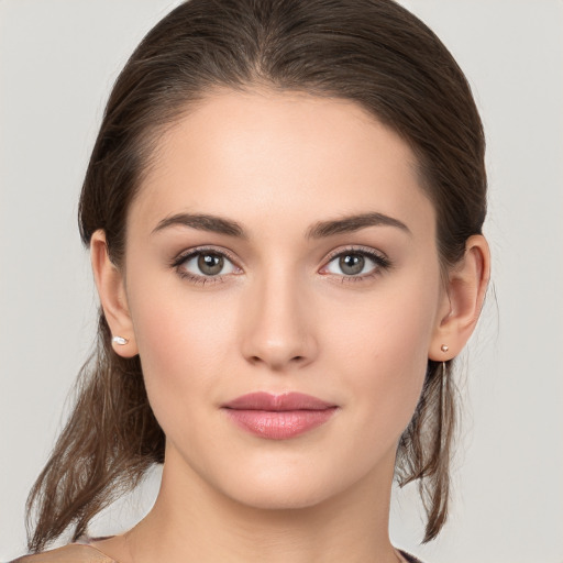 Neutral white young-adult female with medium  brown hair and brown eyes