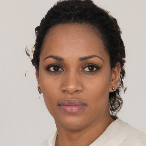 Neutral black young-adult female with short  black hair and brown eyes