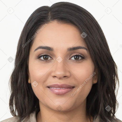 Joyful latino young-adult female with long  brown hair and brown eyes