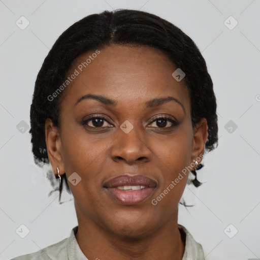 Joyful black adult female with medium  brown hair and brown eyes
