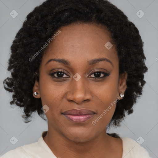 Joyful black adult female with short  brown hair and brown eyes