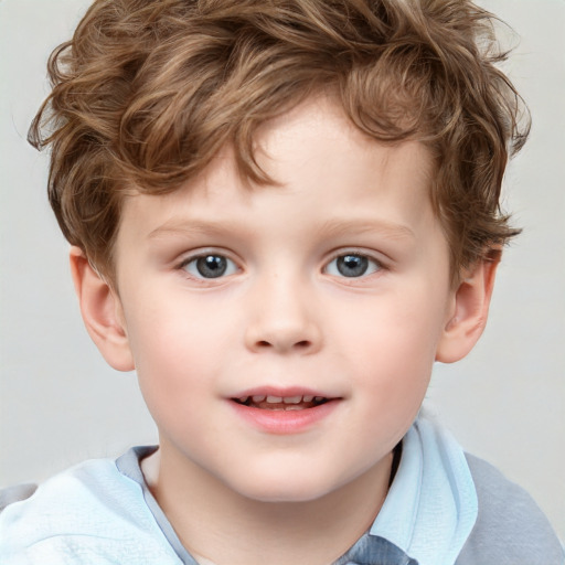 Joyful white child male with short  brown hair and blue eyes