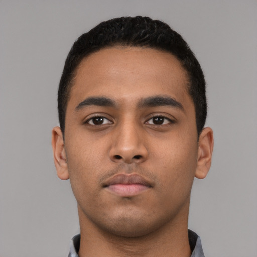 Neutral latino young-adult male with short  black hair and brown eyes