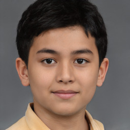 Joyful white child male with short  brown hair and brown eyes