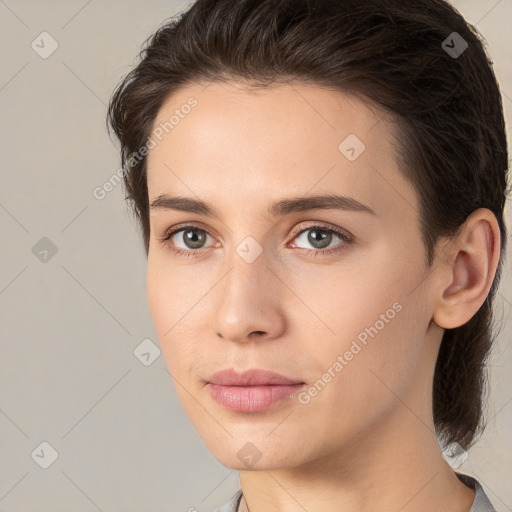 Neutral white young-adult female with medium  brown hair and brown eyes