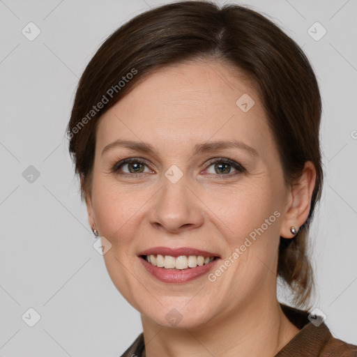 Joyful white adult female with medium  brown hair and grey eyes