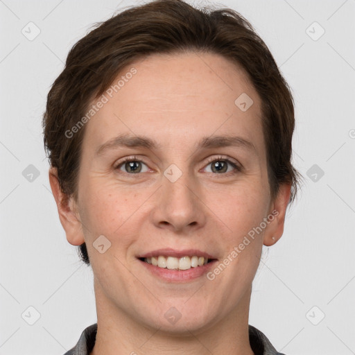 Joyful white young-adult female with short  brown hair and grey eyes