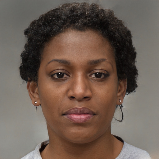 Neutral black young-adult female with short  brown hair and brown eyes