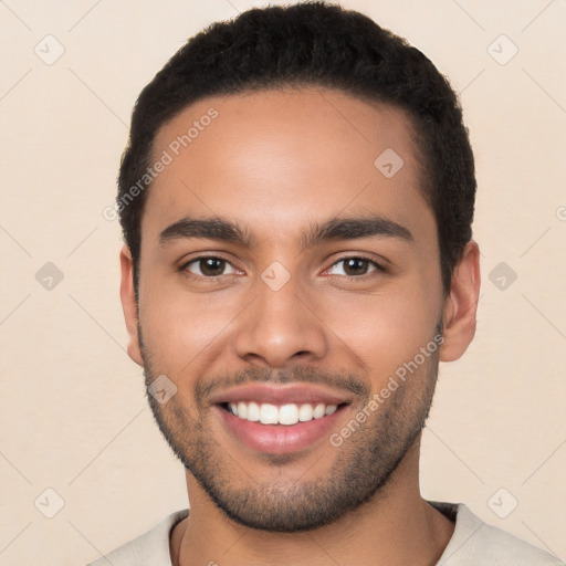 Joyful white young-adult male with short  black hair and brown eyes