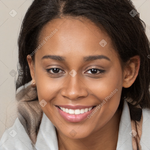 Joyful black young-adult female with medium  brown hair and brown eyes