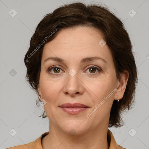 Joyful white adult female with medium  brown hair and grey eyes