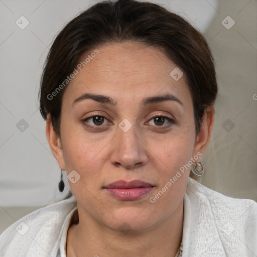 Joyful white adult female with short  brown hair and brown eyes