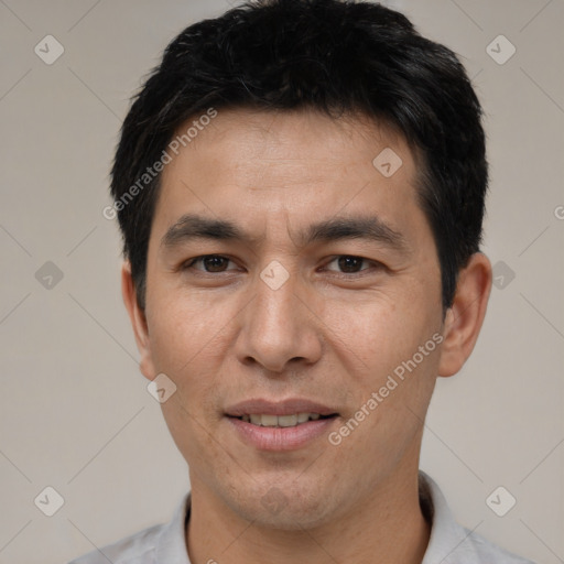 Joyful white adult male with short  brown hair and brown eyes