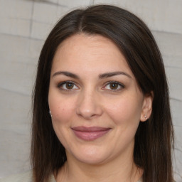 Joyful white adult female with medium  brown hair and brown eyes