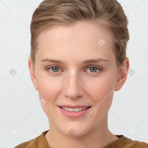 Joyful white young-adult female with short  brown hair and grey eyes