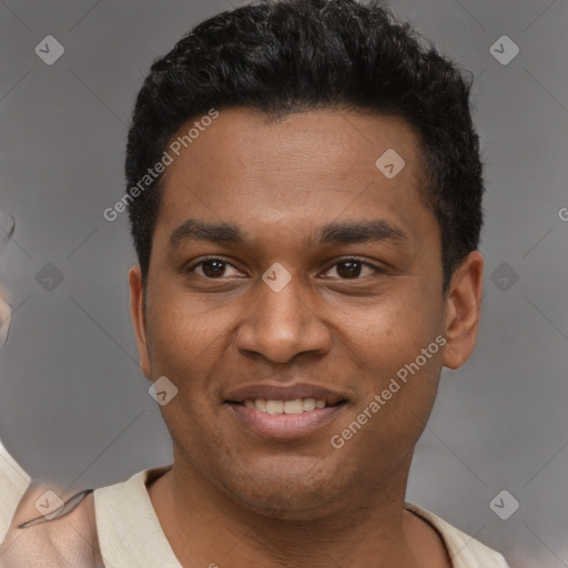 Joyful latino young-adult male with short  brown hair and brown eyes