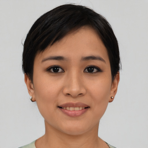 Joyful asian young-adult female with short  black hair and brown eyes