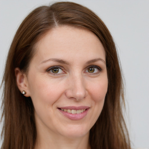 Joyful white young-adult female with long  brown hair and grey eyes