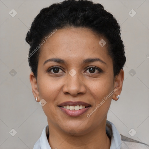 Joyful latino young-adult female with short  black hair and brown eyes