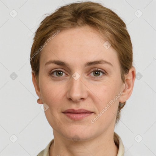 Joyful white adult female with short  brown hair and grey eyes