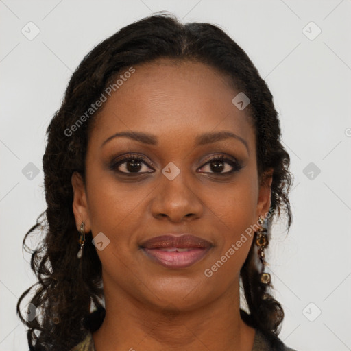 Joyful black young-adult female with long  brown hair and brown eyes