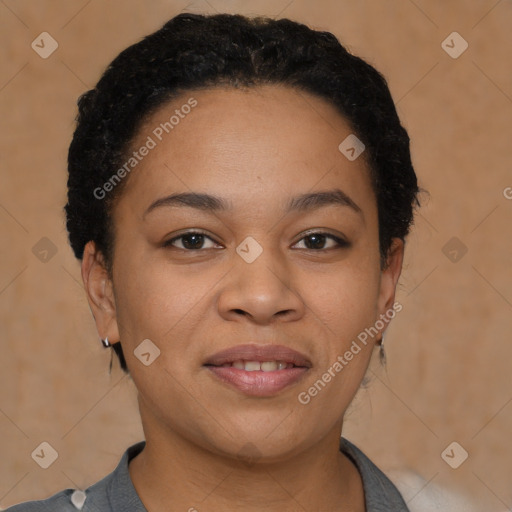 Joyful black young-adult female with short  black hair and brown eyes