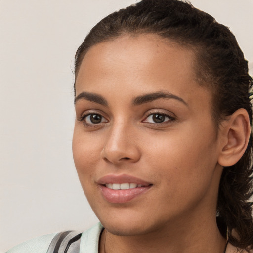 Joyful white young-adult female with medium  brown hair and brown eyes