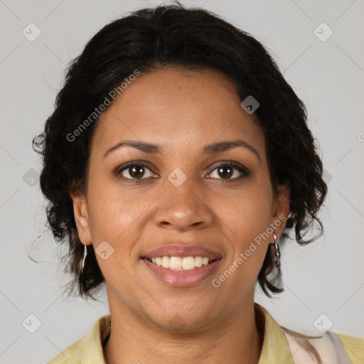 Joyful black adult female with medium  brown hair and brown eyes