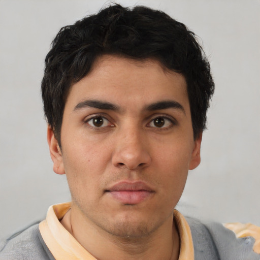 Neutral white young-adult male with short  black hair and brown eyes