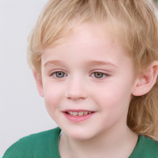 Joyful white child female with short  brown hair and blue eyes